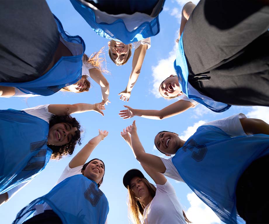 Teenagers in sport team high fiving